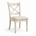 Chaise en bois blanc vieilli avec dossier croisé
